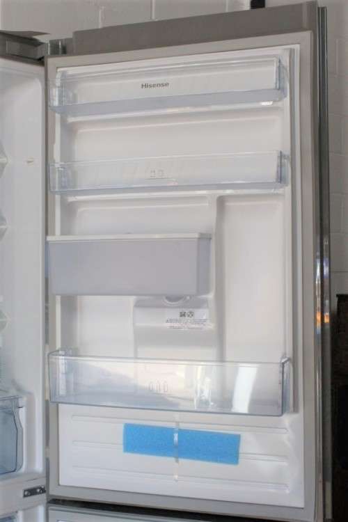 A style Hisense 323 litre mirror-front upright fridge-freezer combo with water dispenser