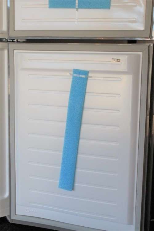 A style Hisense 323 litre mirror-front upright fridge-freezer combo with water dispenser