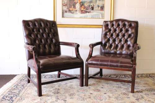 A magnificent large PU leather Gainsborough armchair w/ carved detailed armrests - 2x Available