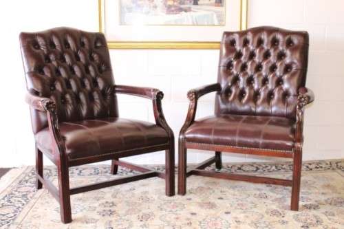 A magnificent large PU leather Gainsborough armchair w/ carved detailed armrests - 2x Available