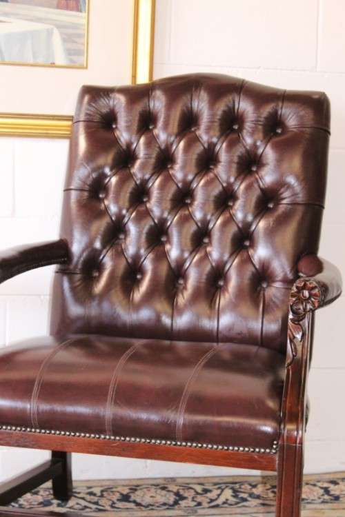 A magnificent large PU leather Gainsborough armchair w/ carved detailed armrests - 2x Available