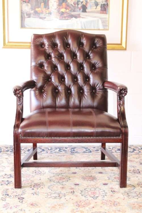 A magnificent large PU leather Gainsborough armchair w/ carved detailed armrests - 2x Available