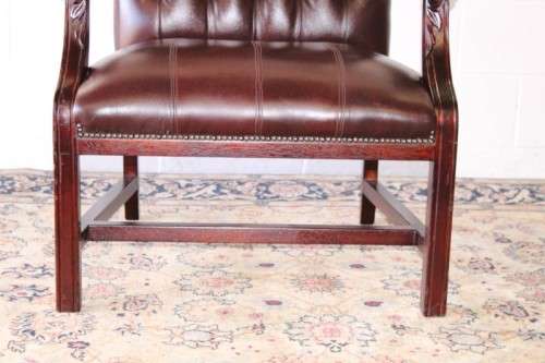 A magnificent large PU leather Gainsborough armchair w/ carved detailed armrests - 2x Available