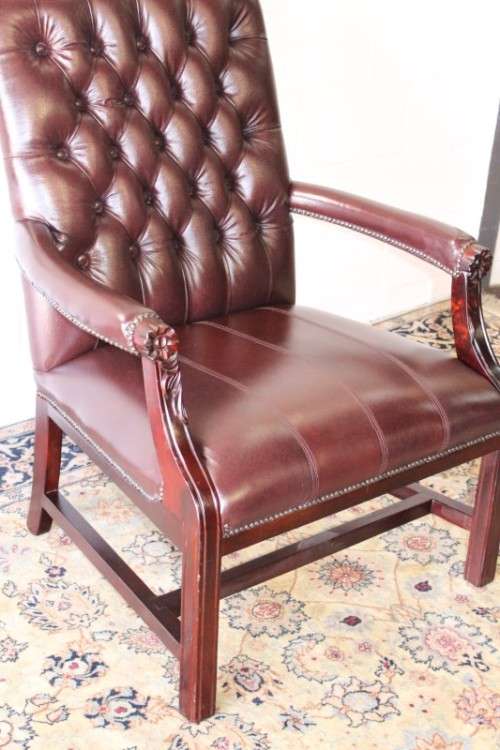 A magnificent large PU leather Gainsborough armchair w/ carved detailed armrests - 2x Available