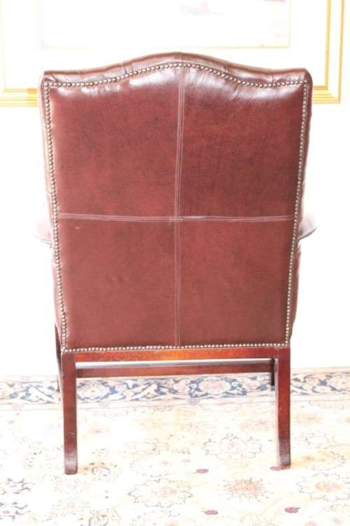 A magnificent large PU leather Gainsborough armchair w/ carved detailed armrests - 2x Available