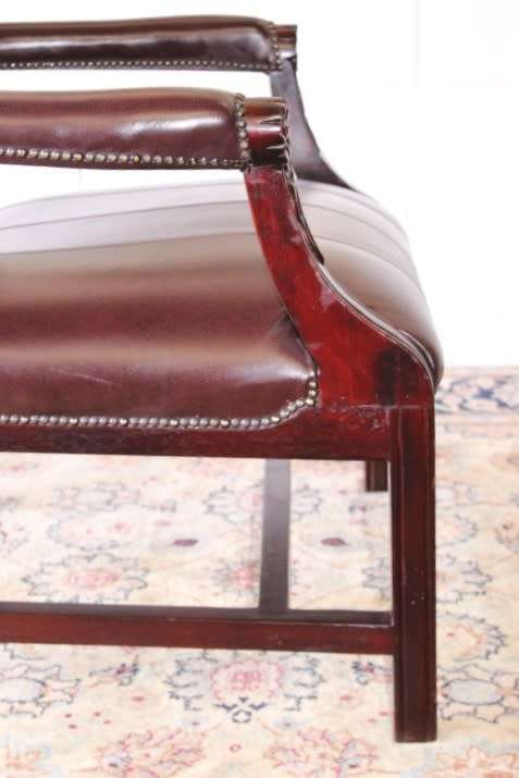 A magnificent large PU leather Gainsborough armchair w/ carved detailed armrests - 2x Available