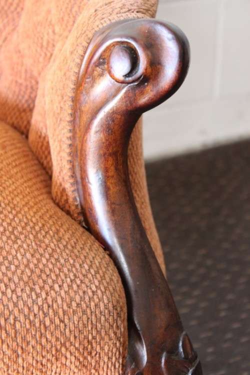A beautiful antique Victorian Walnut deep-button camel-back sofa with stunning hand-carved detailing