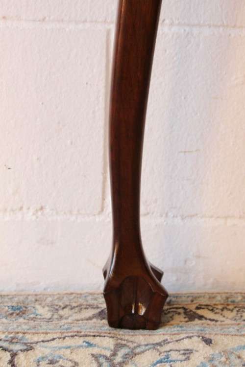 A stylish vintage solid Imbuia ball and claw half moon display/occasional table w/ a scalloped edge