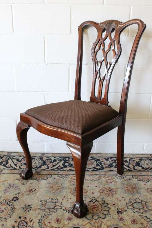 A superb set of eight vintage Stinkwood carved & upholstered ball and claw chairs incl. two carvers