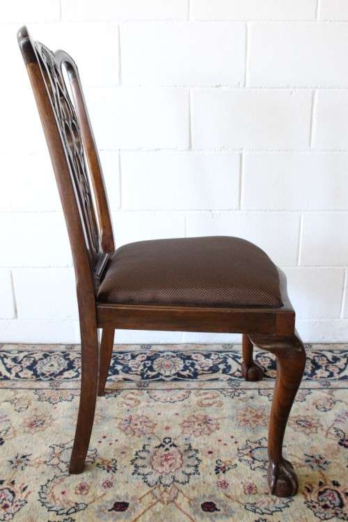 A superb set of eight vintage Stinkwood carved & upholstered ball and claw chairs incl. two carvers