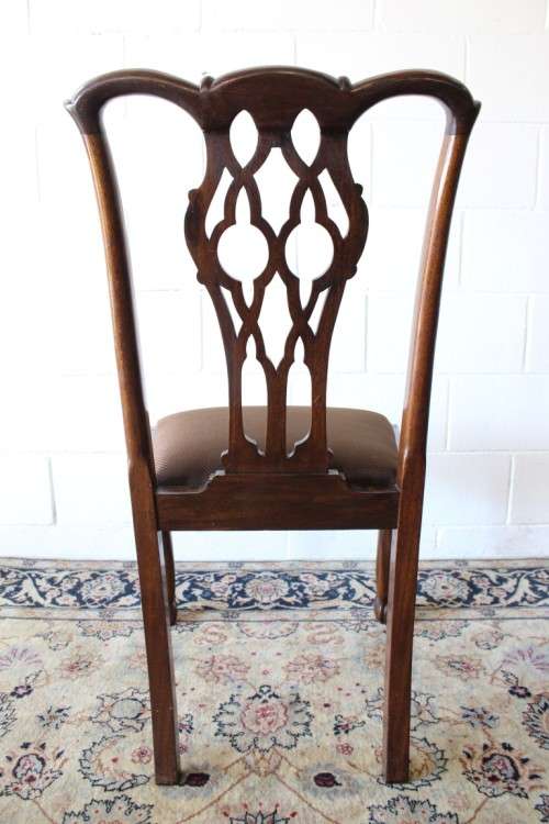 A superb set of eight vintage Stinkwood carved & upholstered ball and claw chairs incl. two carvers