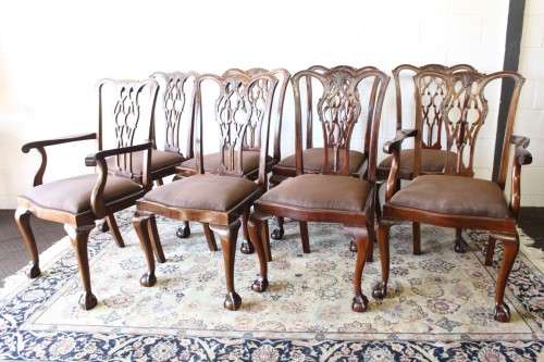 A superb set of eight vintage Stinkwood carved & upholstered ball and claw chairs incl. two carvers
