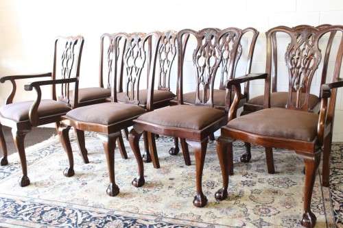 A superb set of eight vintage Stinkwood carved & upholstered ball and claw chairs incl. two carvers