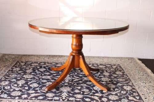 **RS17** A well made round glass-top hall/ foyer table w/ solid turned pedestal leg & broad fascia