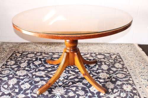 **RS17** A well made round glass-top hall/ foyer table w/ solid turned pedestal leg & broad fascia