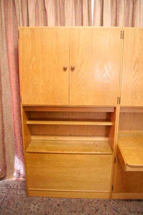 **RS17** A beautifully made wall unit/ cabinet with loads of cupboards and a lift top writing desk.