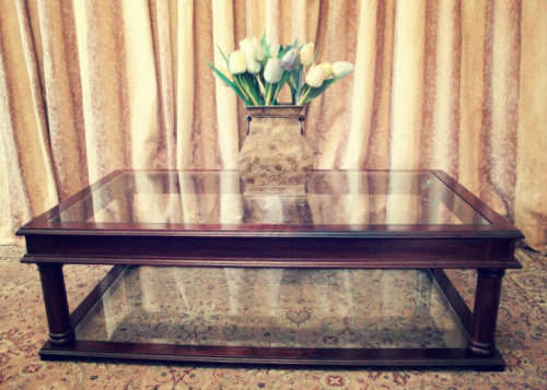 A fabulous, large glass top and bottom Mahogany coffee table with straight clean lines