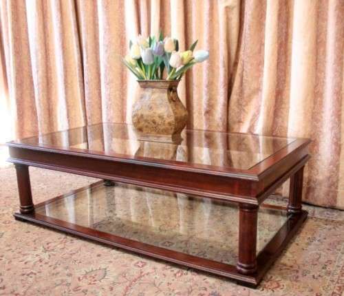 A fabulous, large glass top and bottom Mahogany coffee table with straight clean lines