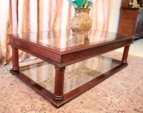 A fabulous, large glass top and bottom Mahogany coffee table with straight clean lines