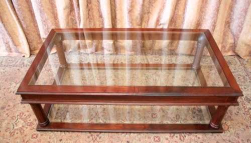 A fabulous, large glass top and bottom Mahogany coffee table with straight clean lines