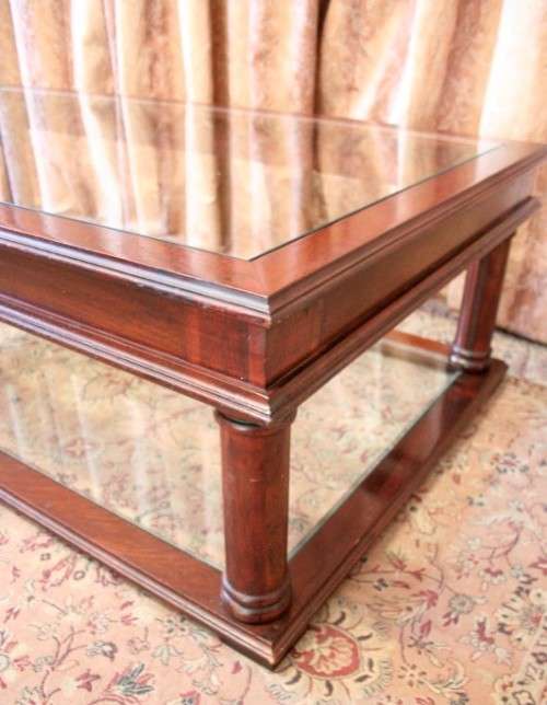 A fabulous, large glass top and bottom Mahogany coffee table with straight clean lines