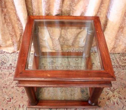A stunning glass top and bottom Mahogany side table with straight clean lines
