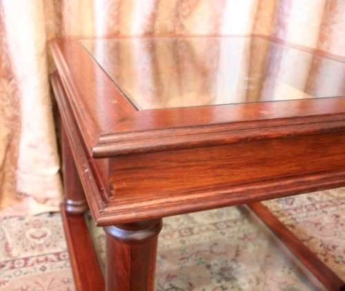 A stunning glass top and bottom Mahogany side table with straight clean lines