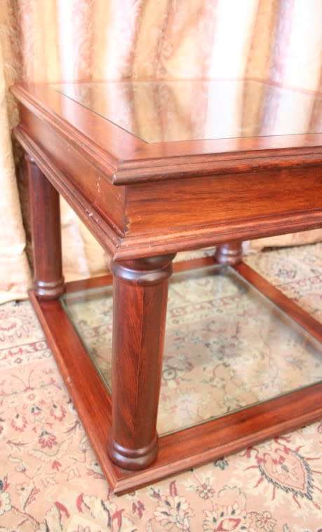 A stunning glass top and bottom Mahogany side table with straight clean lines