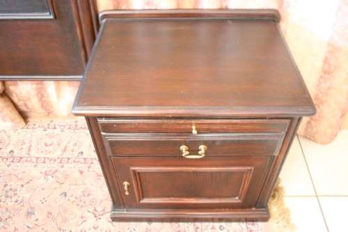 A fabulous Mahogany (168cm) queen size headboard and two pedestals with drawers and cupboards.