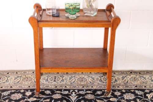 **RS17** A wonderful solid oak 2-tier tea/ drinks trolley w/ removable tray on its original castors