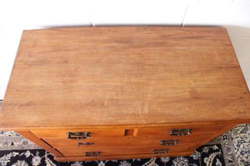 **RS17** An antique four-drawer (2-over-2) yellow wood chest of drawers w/ metal Art Nouveau handles