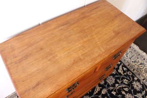 **RS17** An antique four-drawer (2-over-2) yellow wood chest of drawers w/ metal Art Nouveau handles