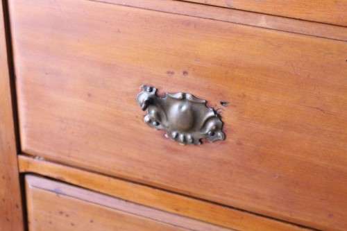 **RS17** An antique four-drawer (2-over-2) yellow wood chest of drawers w/ metal Art Nouveau handles