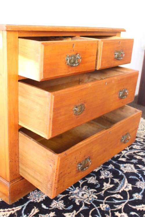 **RS17** An antique four-drawer (2-over-2) yellow wood chest of drawers w/ metal Art Nouveau handles