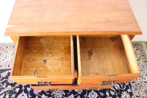 **RS17** An antique four-drawer (2-over-2) yellow wood chest of drawers w/ metal Art Nouveau handles