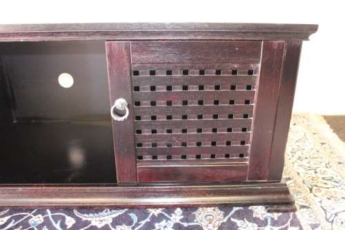 A dark-brown stained 1.7m long double door entertainment/ TV unit with ample space for components