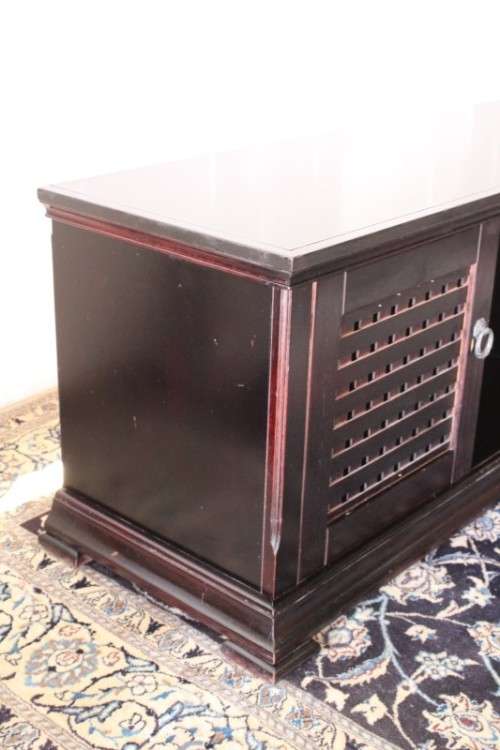 A dark-brown stained 1.7m long double door entertainment/ TV unit with ample space for components