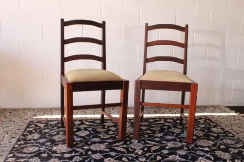 **RS17** Two solidly made vintage/ antique? solid teak occasional chairs in a sand colour fabric
