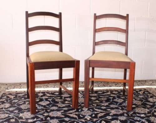 **RS17** Two solidly made vintage/ antique? solid teak occasional chairs in a sand colour fabric
