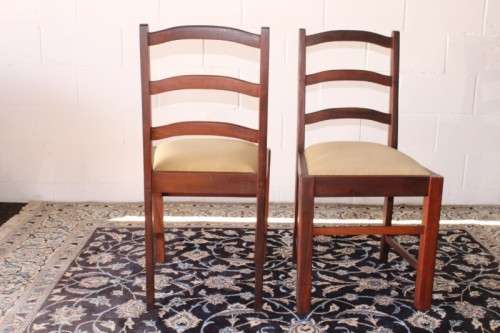 **RS17** Two solidly made vintage/ antique? solid teak occasional chairs in a sand colour fabric