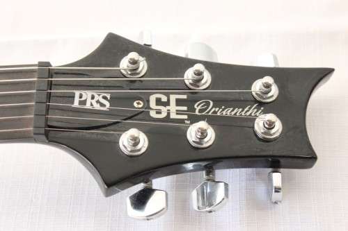A awesome PRS SE Orianthi signature "red sparkle" electric guitar in good condition w/ carry bag!