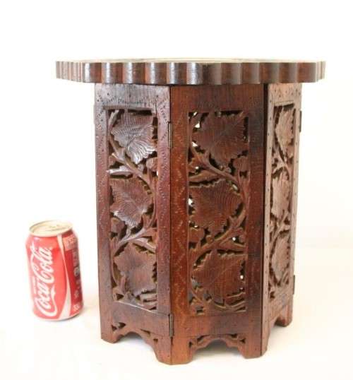 **RS17** A carved round Indian wood occasional/ side table with inlay detail and a hexagon base.
