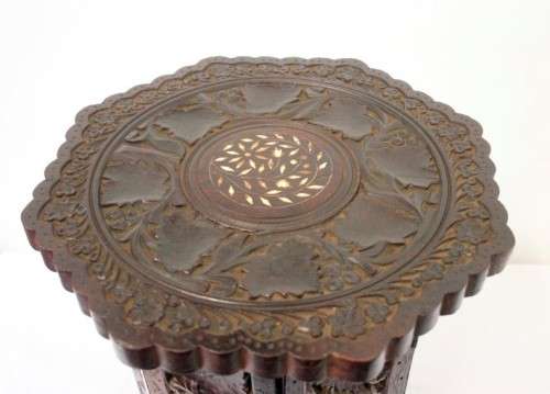 **RS17** A carved round Indian wood occasional/ side table with inlay detail and a hexagon base.