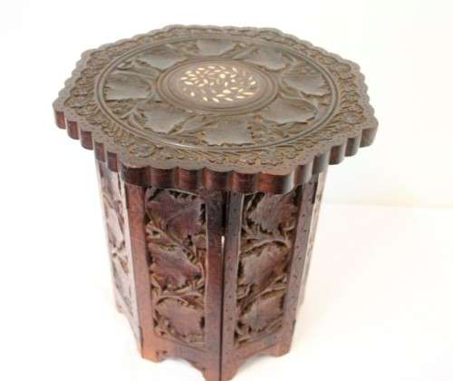 **RS17** A carved round Indian wood occasional/ side table with inlay detail and a hexagon base.