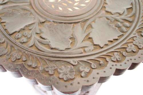 **RS17** A carved round Indian wood occasional/ side table with inlay detail and a hexagon base.