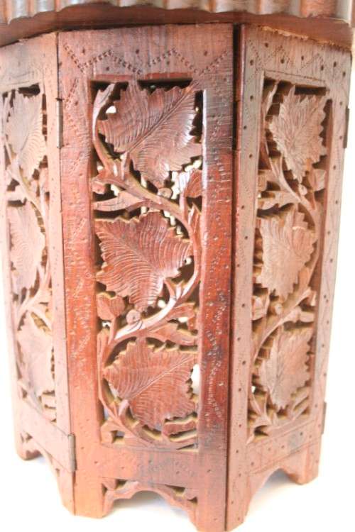 **RS17** A carved round Indian wood occasional/ side table with inlay detail and a hexagon base.