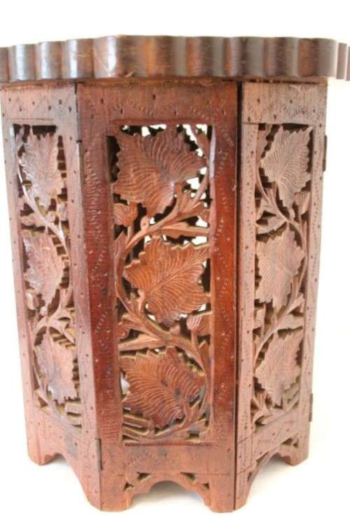**RS17** A carved round Indian wood occasional/ side table with inlay detail and a hexagon base.