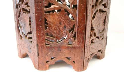 **RS17** A carved round Indian wood occasional/ side table with inlay detail and a hexagon base.