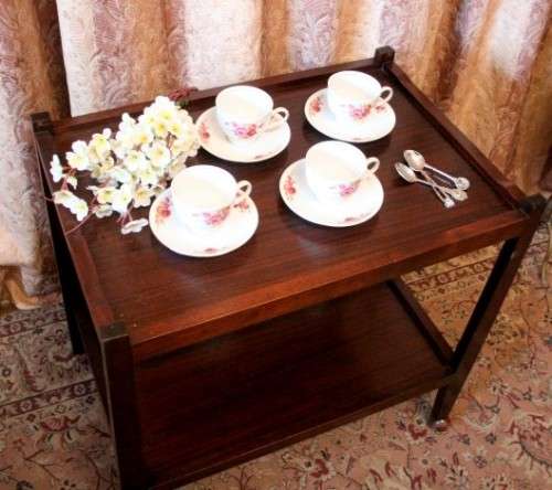 A lovely vintage wooden butlers trolley on wheels, perfect drinks/snacks trolley.