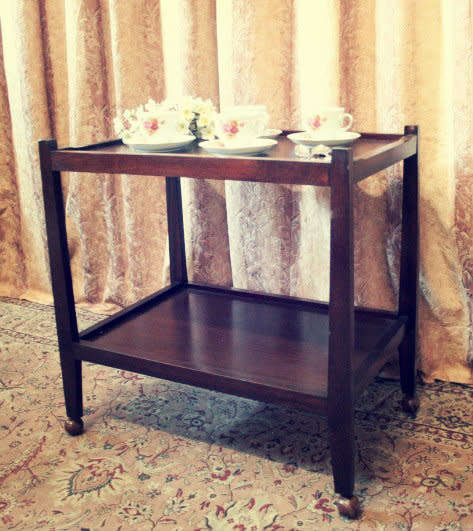 A lovely vintage wooden butlers trolley on wheels, perfect drinks/snacks trolley.